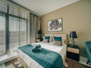 Ένα ή περισσότερα κρεβάτια σε δωμάτιο στο Artesia Tower