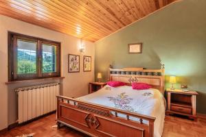 Ένα ή περισσότερα κρεβάτια σε δωμάτιο στο Villa Lolli
