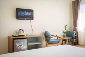 TV a/nebo společenská místnost v ubytování Farmer Community Hotel