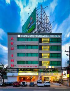 a building with a sign on top of it at Aku Inn Cebu City in Cebu City