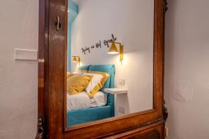 Postel nebo postele na pokoji v ubytování Case Ospitali - Casa La Fontanella, suggestivo bilocale x2 in corte