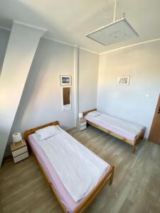 Posteľ alebo postele v izbe v ubytovaní Hostel Universus