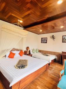 Postel nebo postele na pokoji v ubytování Homestay Thác Liên Khương
