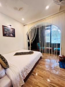Postel nebo postele na pokoji v ubytování Homestay Thác Liên Khương