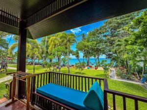 a balcony with a view of the ocean at Baan Thai Lanta Resort in Ko Lanta