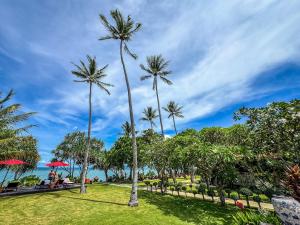 a group of palm trees in a park at Baan Thai Lanta Resort in Ko Lanta +199 photos