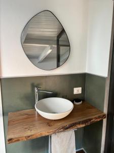 a bathroom with a sink and a mirror at Casa Eliana appartamento Sole in Meina +27 photos