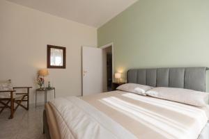 Postel nebo postele na pokoji v ubytování Casa di Leo - HelloElba