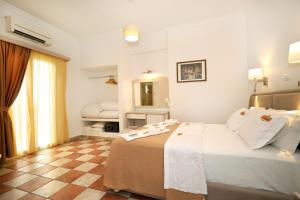 Postel nebo postele na pokoji v ubytování Hotel Klonos - Kyriakos Klonos