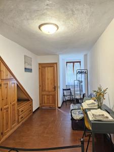 a living room with a staircase and a table at La Lanterna in Corniglia +70 photos