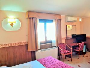 TV a/nebo společenská místnost v ubytování Hotel Riviera Fiumicino