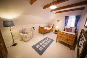 Televízia a/alebo spoločenská miestnosť v ubytovaní Gemütliches Ferienhaus In Feistritz Ob Bleiburg