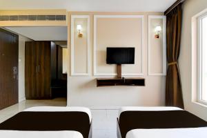 TV a/nebo společenská místnost v ubytování Townhouse OAK Nilay Residency