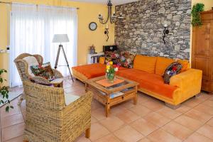a living room with a couch and chairs and a table at Ferienhaus Am Bodensee Mit Garten Und Terrasse in Radolfzell am Bodensee