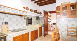 Kuchyň nebo kuchyňský kout v ubytování Los Abilios + 31 fotografií