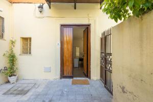 an entrance to a house with a wooden door at Cecilia Guest House in Rome