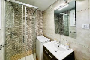 a bathroom with a toilet and a sink and a shower at Home Formentor Salou in Salou