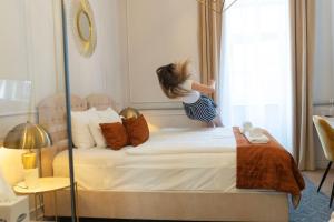 Posteľ alebo postele v izbe v ubytovaní 1552 Boutique Hotel