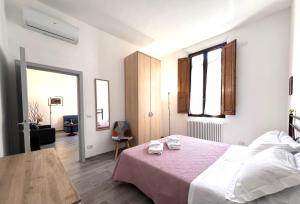 Voodi või voodid majutusasutuse Ortensia-central apartment with terrace toas