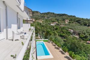 a view of the pool from the balcony of a house at The Italian Lady - Unit 1 in Alassio