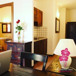 Kuchyň nebo kuchyňský kout v ubytování Residenza Locci - Rooms & Apartments + 37 fotografií
