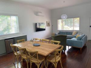 a living room with a table and a couch at Mayfield House Collie in Collie