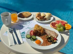 a table with plates of breakfast food on it at Napa Jay Hotel in Ayia Napa +72 photos