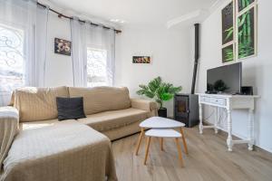 TV a/nebo společenská místnost v ubytování Palmera