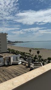 a view of the beach from a balcony of a building at Hotel Progni in Shëngjin