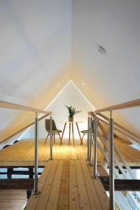 a room with a table and a chair in a attic at Altstadt Apartment V- Studio-3 Personen- Waschmaschine- Parkplatz in Wolfsburg
