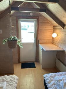 Voodi või voodid majutusasutuse Velling Koller Hotel og Camping toas