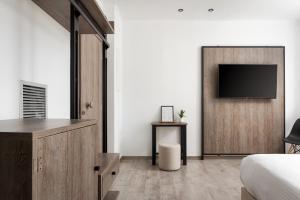 TV a/nebo společenská místnost v ubytování Sette Suites & Rooms - Adults Only