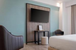 TV a/nebo společenská místnost v ubytování Sette Suites & Rooms - Adults Only