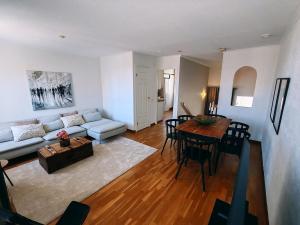 a living room with a couch and a table at Modern apartment in Gamla Stan in Ekenäs