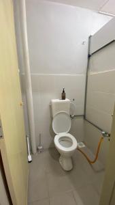 a bathroom with a white toilet in a stall at Sofea Homestay Tasek Gelugor in Kampong Kubang Menderong +7 photos