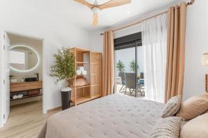 a bedroom with a bed and a large window at Casa Catral Alfalfar 12 in Catral +20 photos