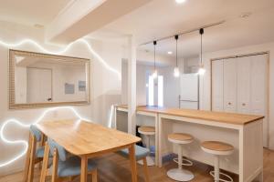 a kitchen with a table and a dining room at Liminal Retreats NAGOYA in Nagoya