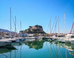 a bunch of boats are docked in a marina at Estudio en el Castillo de Denia in Denia