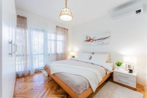 Ένα ή περισσότερα κρεβάτια σε δωμάτιο στο Alka Hvar