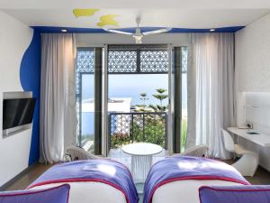 Voodi või voodid majutusasutuse Sofitel Tamuda Bay Beach And Spa toas