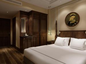 Voodi või voodid majutusasutuse Lotusama Central Hanoi Hotel toas