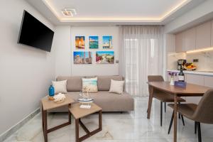 a living room with a couch and a table at Diamante Del Mar Crete Rhodes in Kos