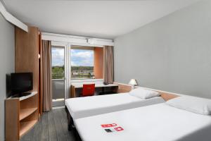 Postel nebo postele na pokoji v ubytování Ibis Budapest Citysouth