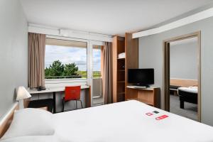 Televízia a/alebo spoločenská miestnosť v ubytovaní Ibis Budapest Citysouth