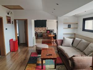 a living room with a couch and a table at Diego in Rijeka