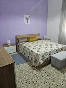 Ένα ή περισσότερα κρεβάτια σε δωμάτιο στο Monolocale e Bilocale centro RC