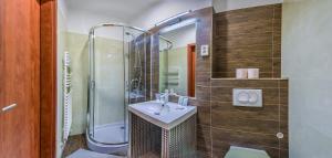 a bathroom with a sink and a shower at Budapest Citi Guesthouse - contactless self check in in Budapest +17 photos