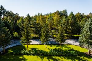 an aerial view of a park with trees and a river at Castle Lakes - Apartamenty in Legnica