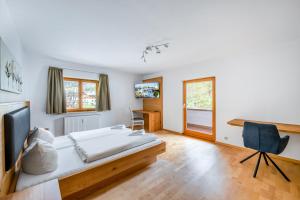 Postel nebo postele na pokoji v ubytování Hotel Garni Nuss