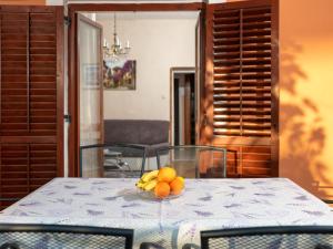 a bowl of fruit sitting on a table at Holiday Home Marijana by Interhome in Sukošan